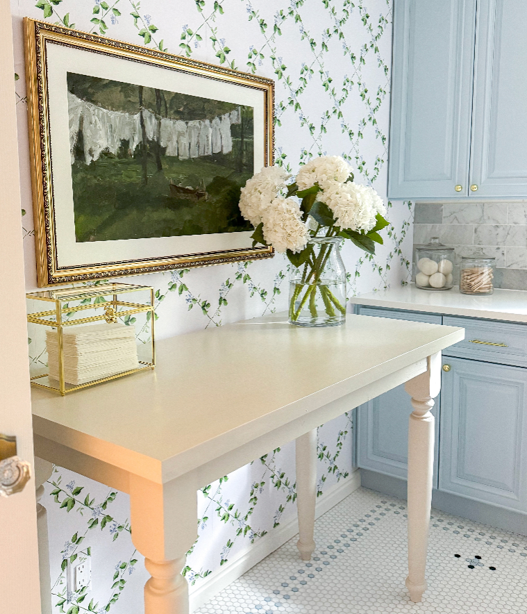Edna geometric patterned wallpaper in white, green, and light-blue tones.