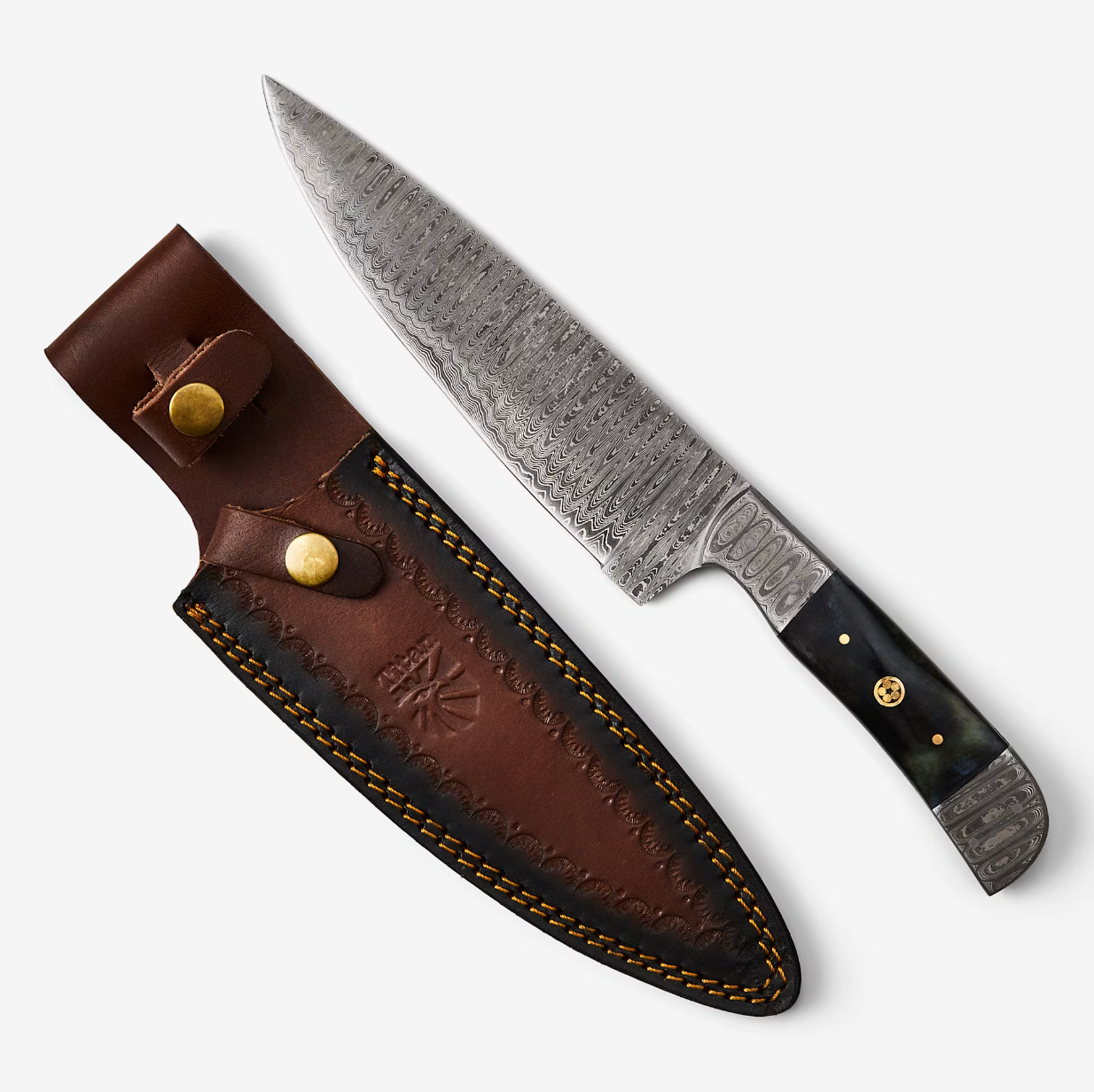 Artisanal Damascus steel kitchen knife with polished bull horn handle and cognac leather sheath