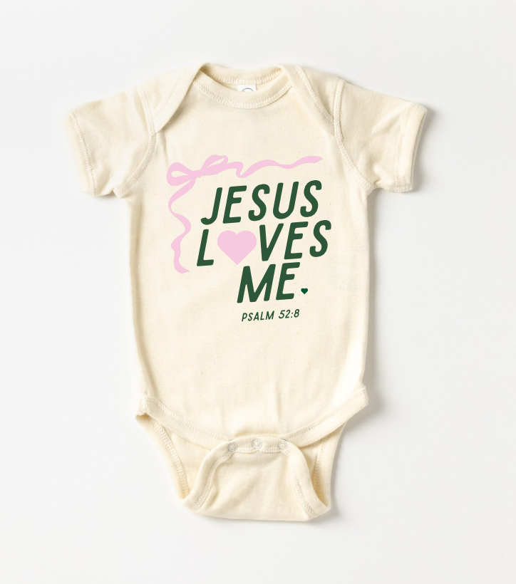 Unisex baby onesie featuring 'Jesus Loves Me' ribbon design in soft colors.
