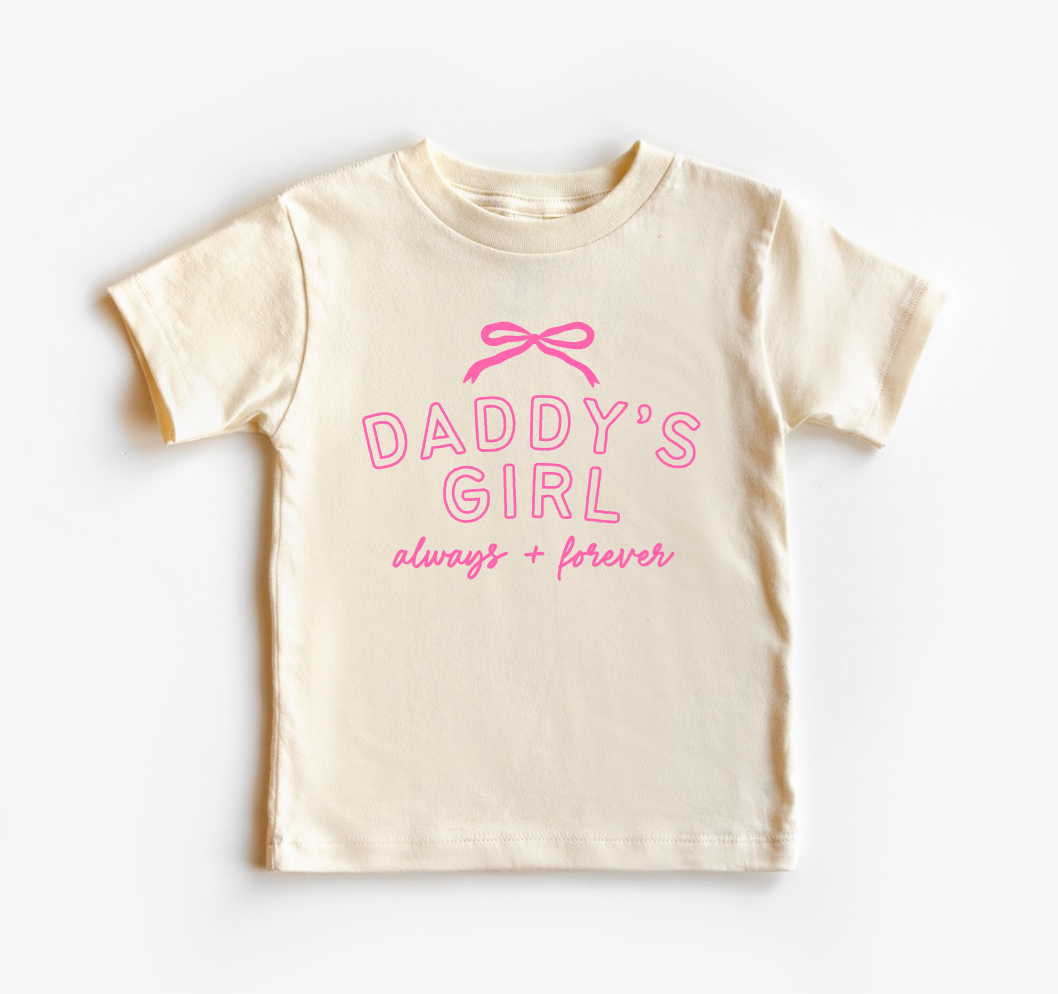 Child wearing a soft pink Daddy's Girl Always + Forever crewneck t-shirt in a minimalist casual style.