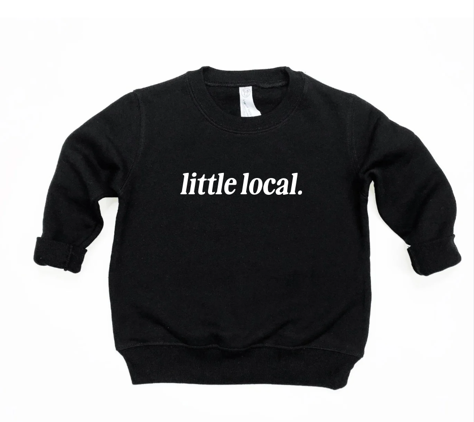 Little Local minimalist black and white pullover for children on a solid background