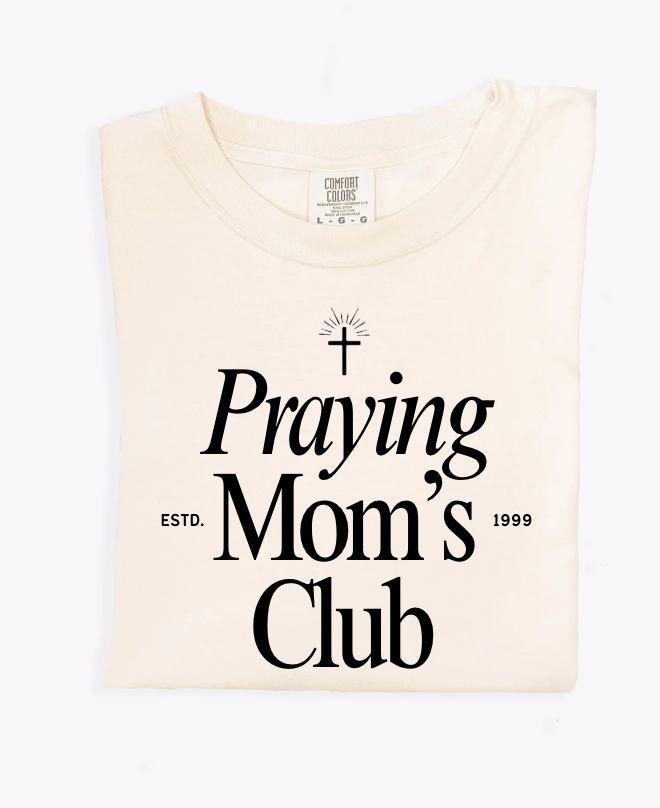 Woman wearing a Praying Mom's Club relaxed fit graphic t-shirt
