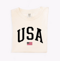 USA Varsity unisex graphic t-shirt in cream, white, and charcoal-grey cotton.