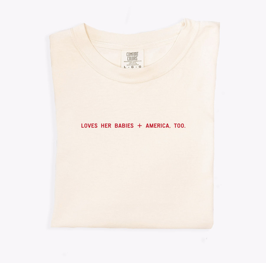 Loves Her Babies + America, Too unisex cream and red cotton graphic t-shirt.