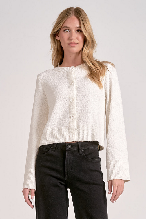 The Cloudlight Cardigan in Off White cotton-blend fabric shown in a lifestyle setting.