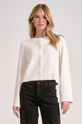 The Cloudlight Cardigan in Off White cotton-blend fabric shown in a lifestyle setting.