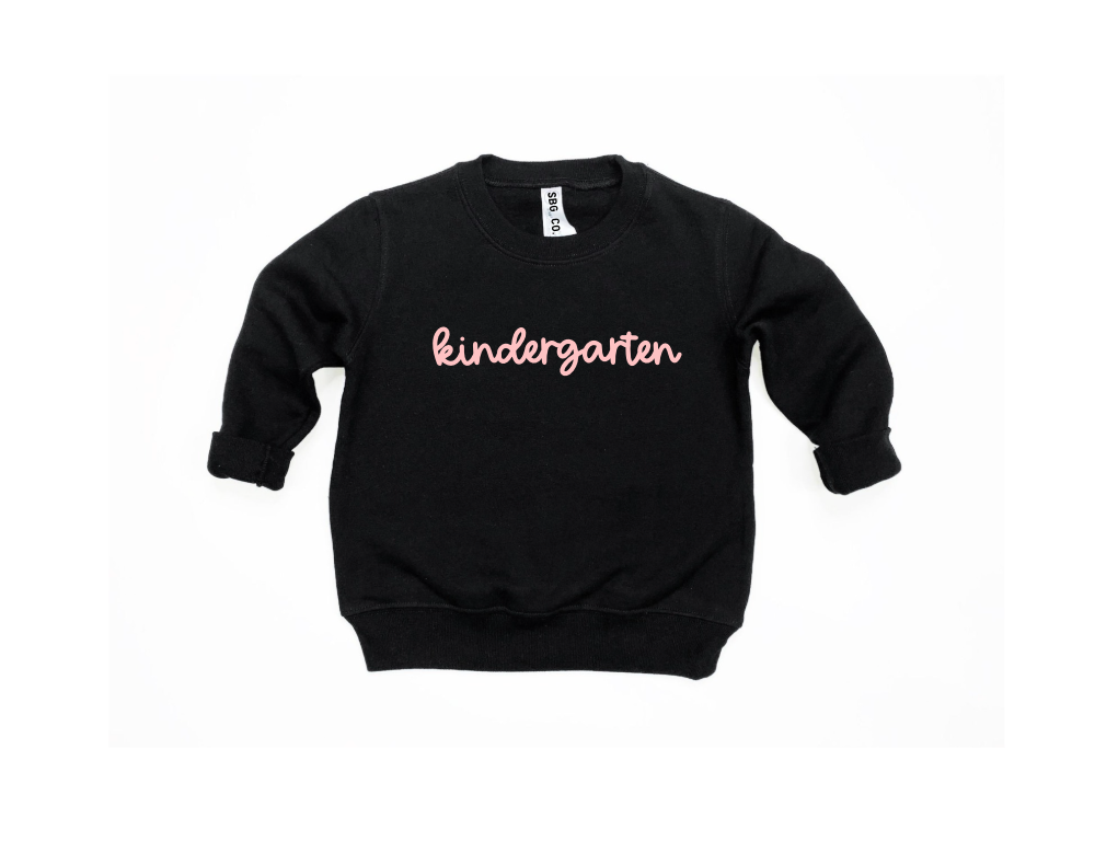A cozy kids pullover sweatshirt with a preppy aesthetic, available in multiple solid colors.