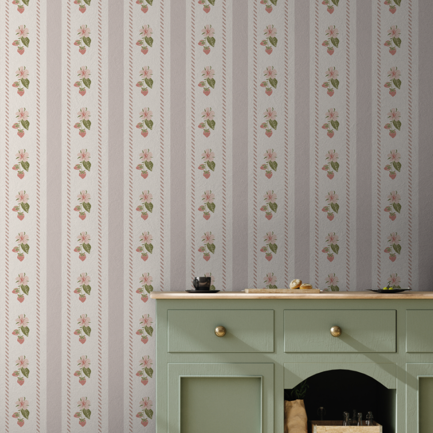 Close up of Tilda floral wallpaper with pink, green, and beige vintage botanical patterns.