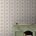 Close up of Tilda floral wallpaper with pink, green, and beige vintage botanical patterns.