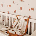 Charming cow print wallpaper pattern for a stylish and cozy baby nursery accent wall.