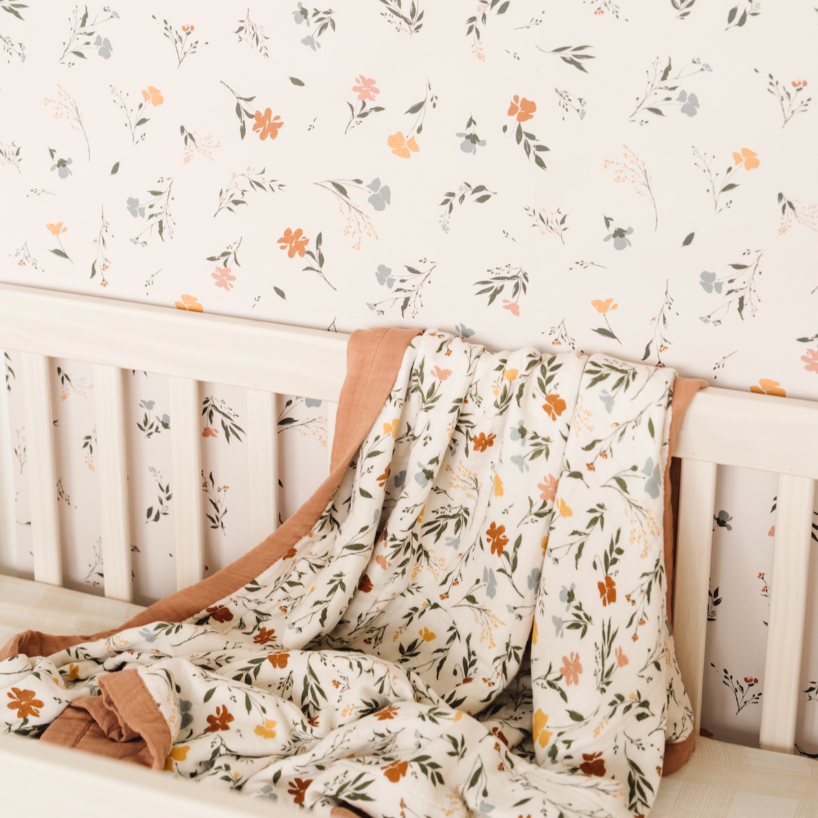 Fleurs Wallpaper featuring a beautiful floral pattern in a nursery setting