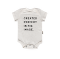 A soft cotton baby onesie in Black or Natural with the text Created Perfect in His Image printed on the front.