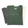 Unisex graphic tee with the text Loves Jesus + Dogs, Too. on a Comfort Colors heavyweight cotton shirt.