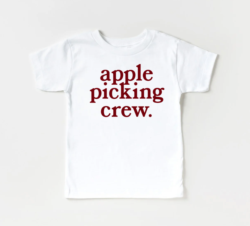 Toddler wearing a comfortable Apple Picking Crew graphic t-shirt outdoors
