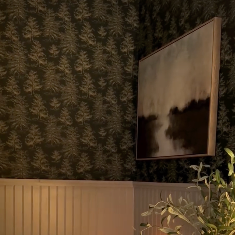 Dakota botanical wallpaper in green, white, and grey, styled for a rustic-modern home.