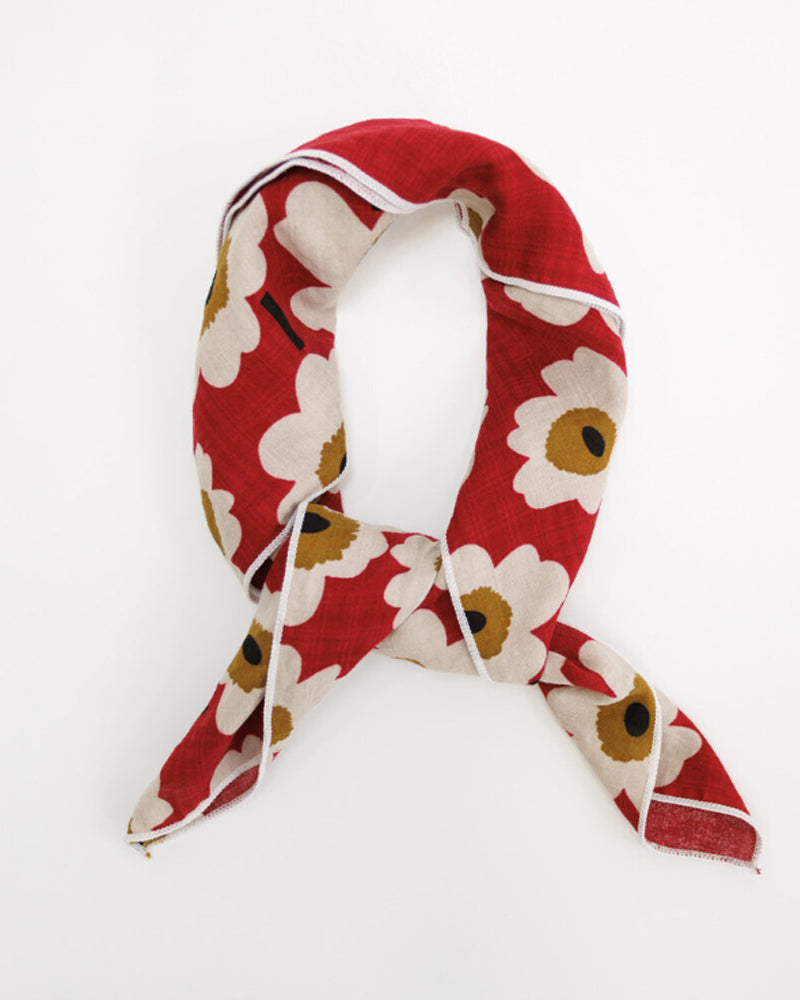 Close-up of Essential Summer Scarf featuring a large-scale floral motif in cream, red, and mustard-yellow cotton.