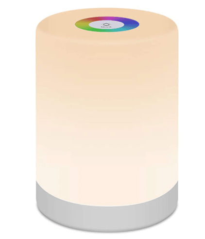 A portable touch-dimmable LED table lamp sitting on a modern bedside table