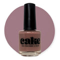 Bottle of CAKE Nail Strengthening Polish in deep mauve shade I Like to Mauve It