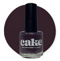 Bottle of CAKE Nail Strengthening Polish in deep plum shade Plum & Circumstance