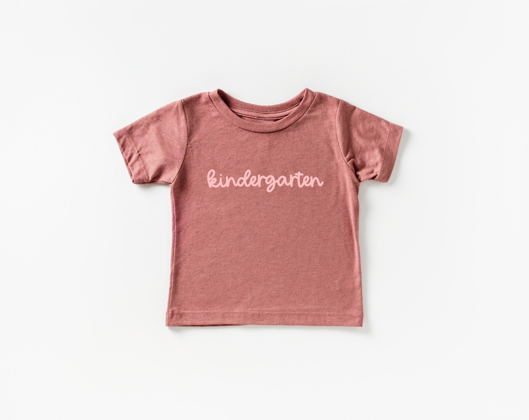 Kindergarten Girly cotton tee available in various colors like mauve and black.