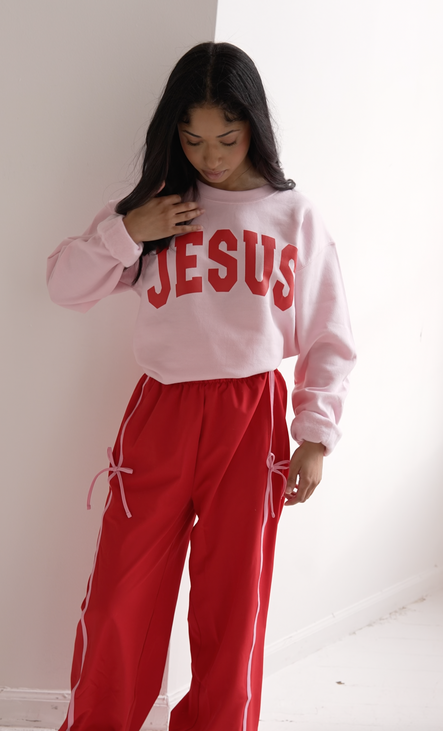 Unisex sweatshirt with Jesus varsity lettering in a casual streetwear style.