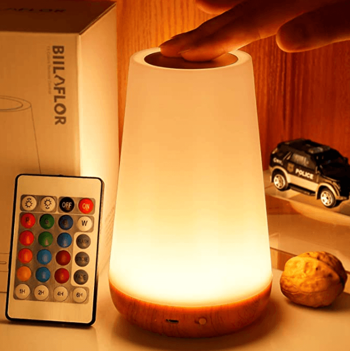 Modern RGB smart table lamp with touch sensor and USB charging port.