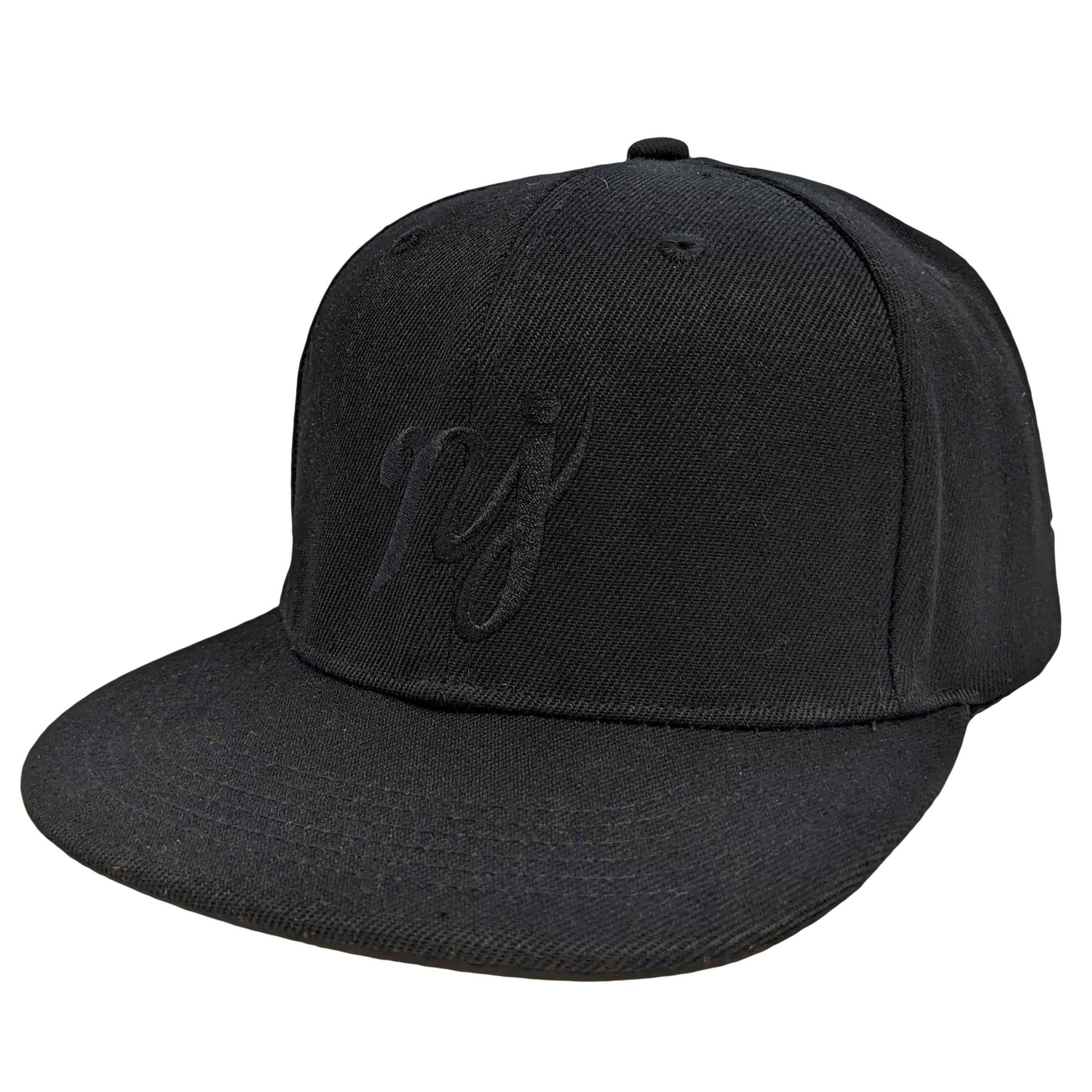 A solid black snapback hat with white NJ scripture embroidery, photographed on a neutral background.
