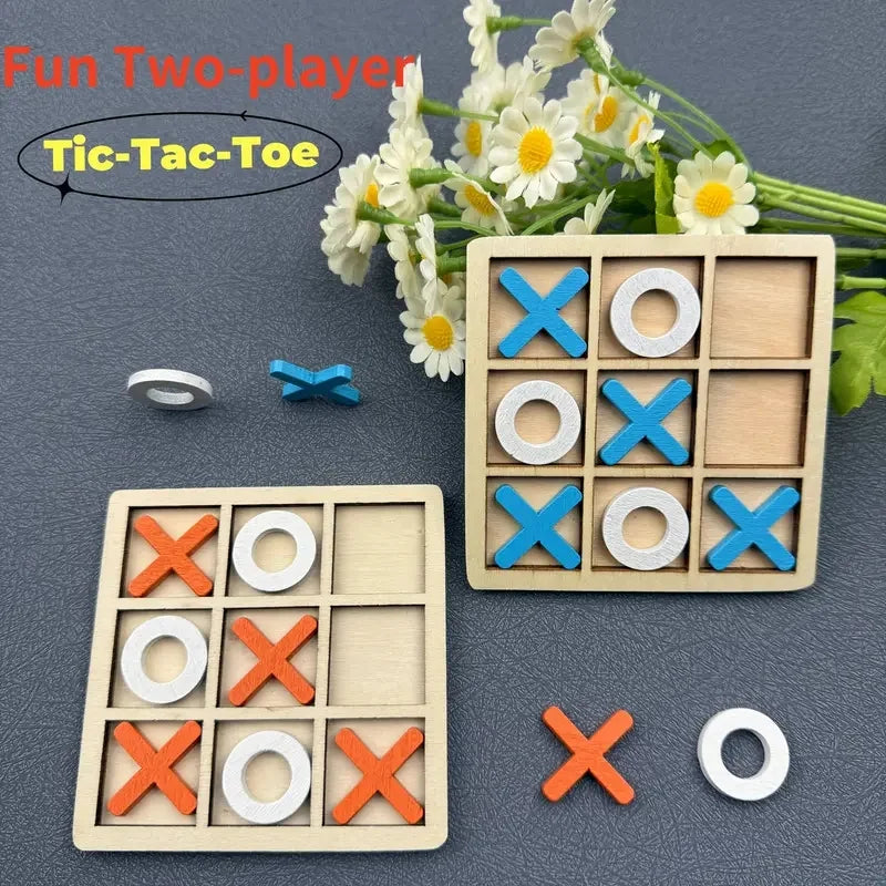 Wooden Tic Tac Toe game set with two boards and blue, orange, and white playing pieces on a grey surface.
