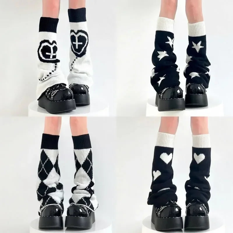 A pair of Y2K Punk knitted leg warmers in black and white with various patterns including hearts, stars, and argyle, worn over platform shoes, showcasing a modern Harajuku street style aesthetic.