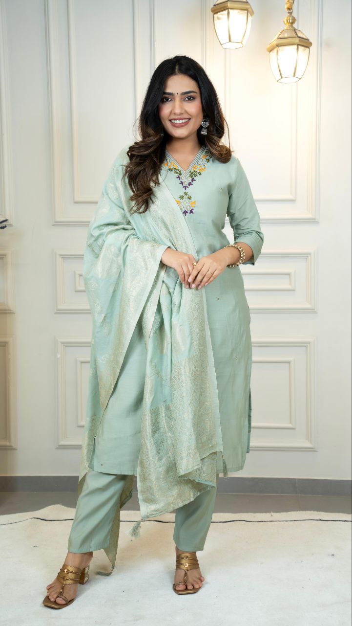 Woman wearing a seagreen Roman silk kurta set with intricate hand-work and matching dupatta