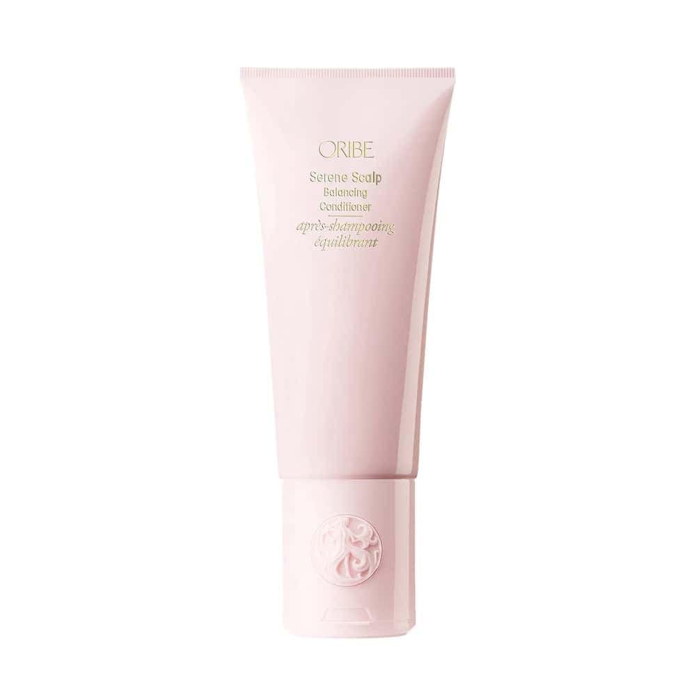 Oribe Serene Scalp Balancing Conditioner bottle on a minimalist background