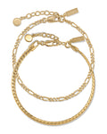 Serpentine Set in gold featuring a sleek, fluid chain design worn as a matching set.