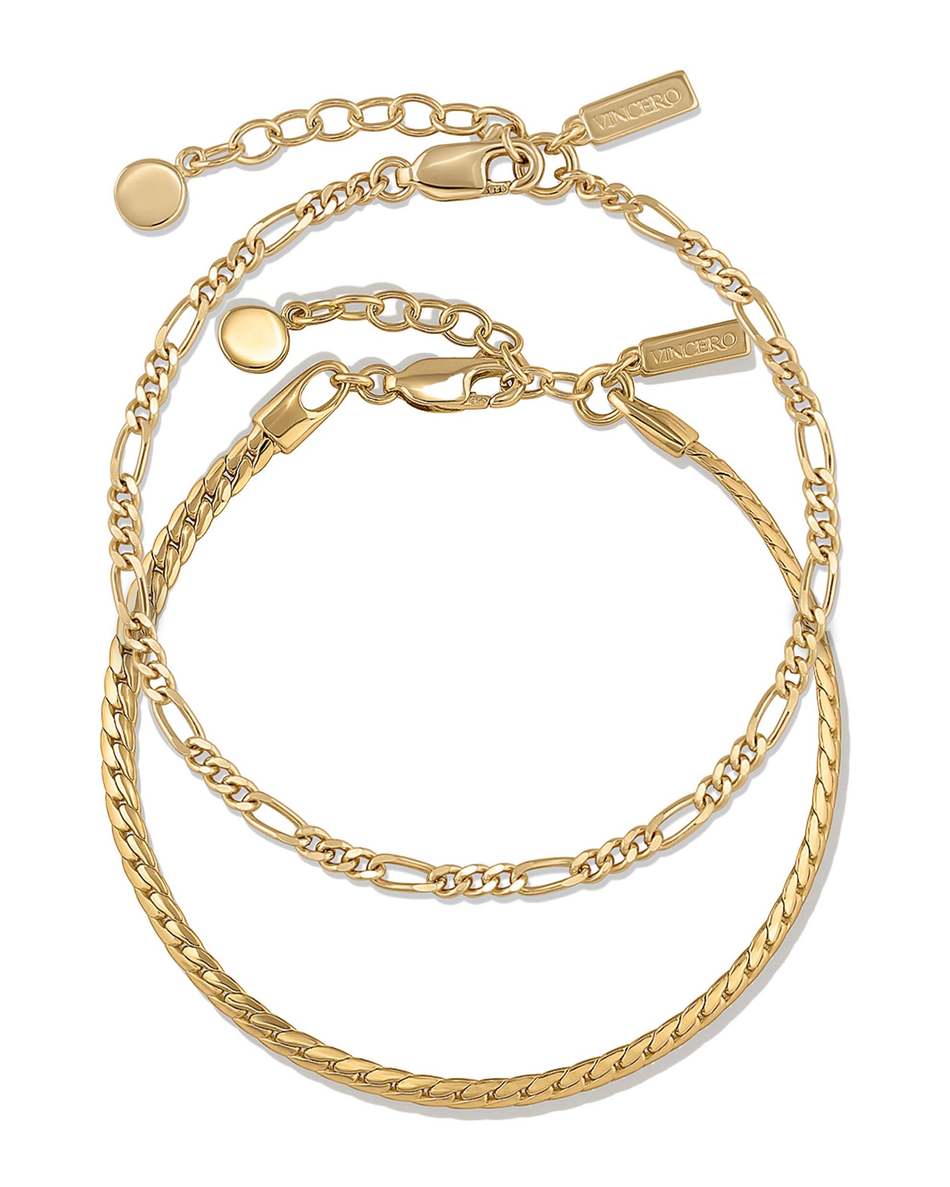 Serpentine Set in gold featuring a sleek, fluid chain design worn as a matching set.