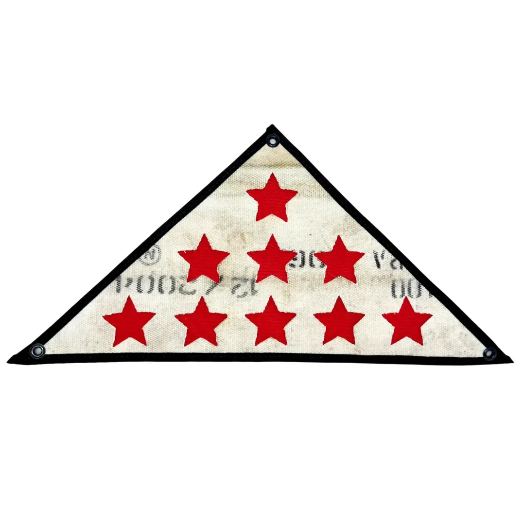 Decorative Service Star Triangle flag made from red, white, and black fire hose with black canvas backing.