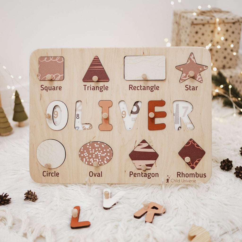 Wooden personalized name puzzle board featuring geometric shapes in beige, terracotta, and brown on a neutral background.