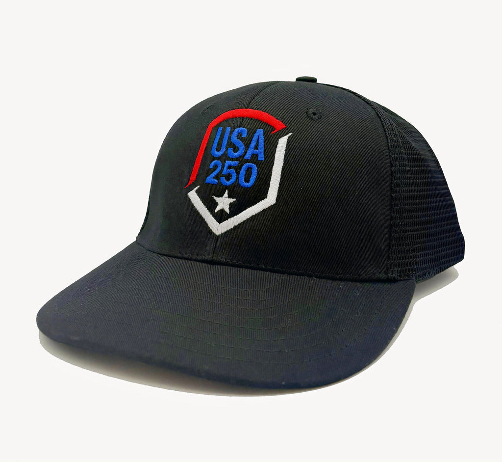 Black trucker style baseball cap with USA 250 shield embroidery on the front panel and mesh back.