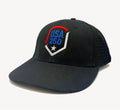 Black trucker style baseball cap with USA 250 shield embroidery on the front panel and mesh back.