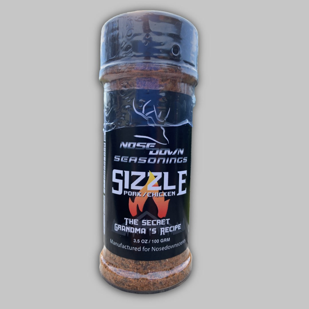 Sizzle Seasoning bottle in a modern black and orange label, perfect for BBQ chicken and pork.