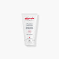 Minimalist white and red jar of Skincode 24h De-Stress Comfort Balm.