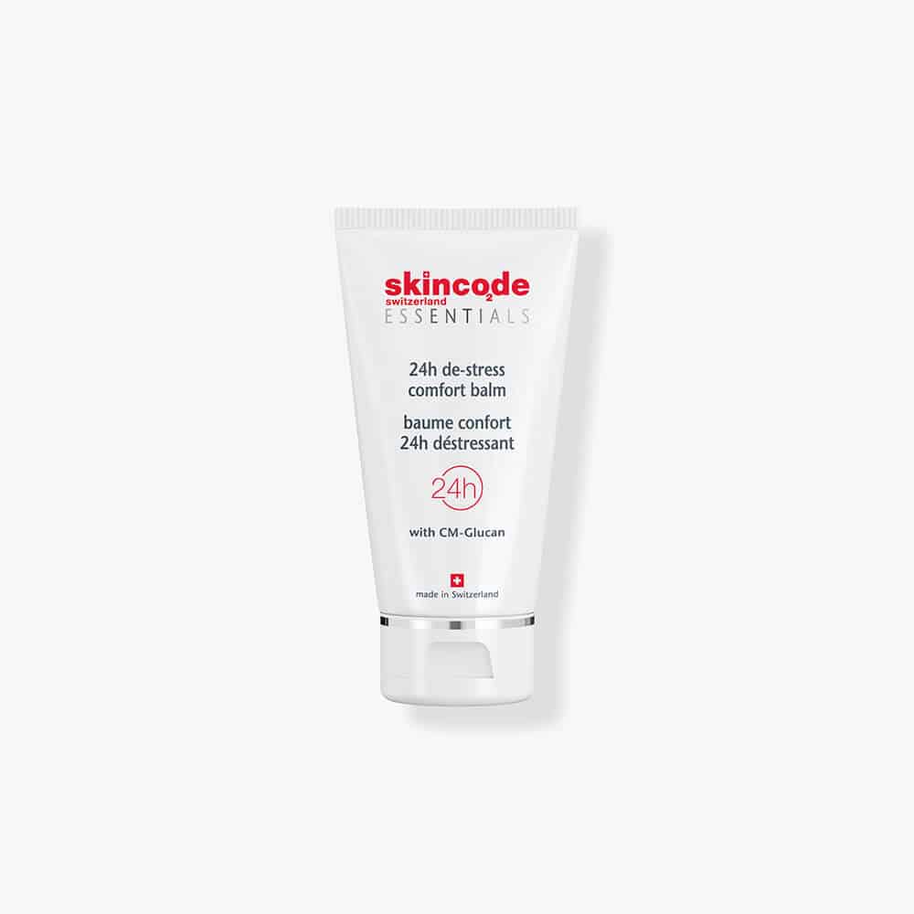 Minimalist white and red jar of Skincode 24h De-Stress Comfort Balm.
