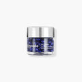 Skincode Cellular Perfect Skin Capsules in a clear glass jar with a silver cap, featuring deep royal blue serum capsules.