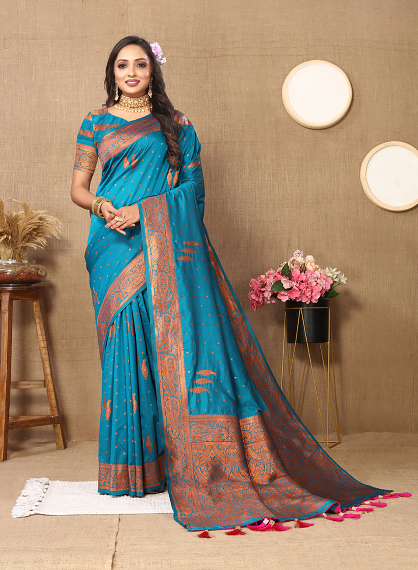 Sky blue soft silk saree with copper zari embroidery, displayed in a traditional ethnic style.