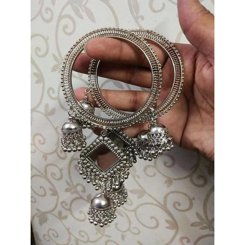 Silver-tone bohemian bangles featuring mirror work and dangling jhumka charms.