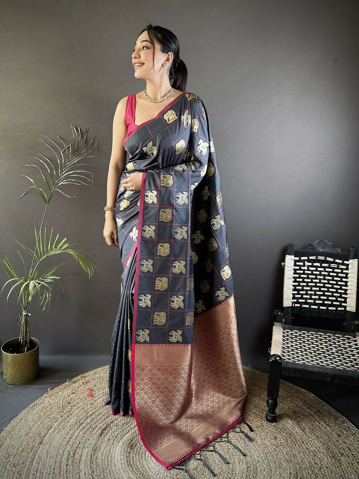 Grey soft silk Banarasi saree with elephant motifs and a red blouse piece