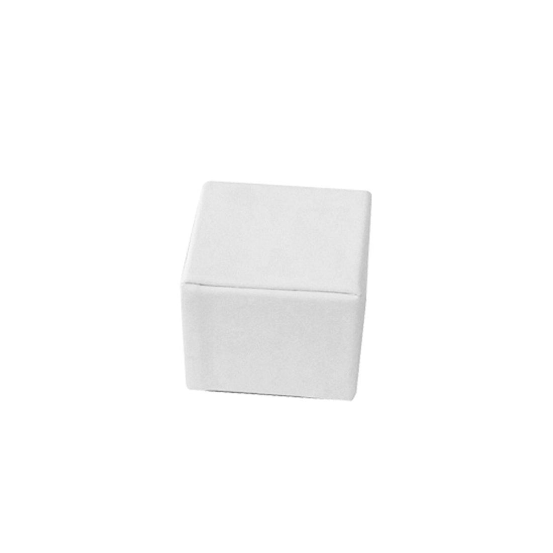A plain white square block used as a jewelry display riser