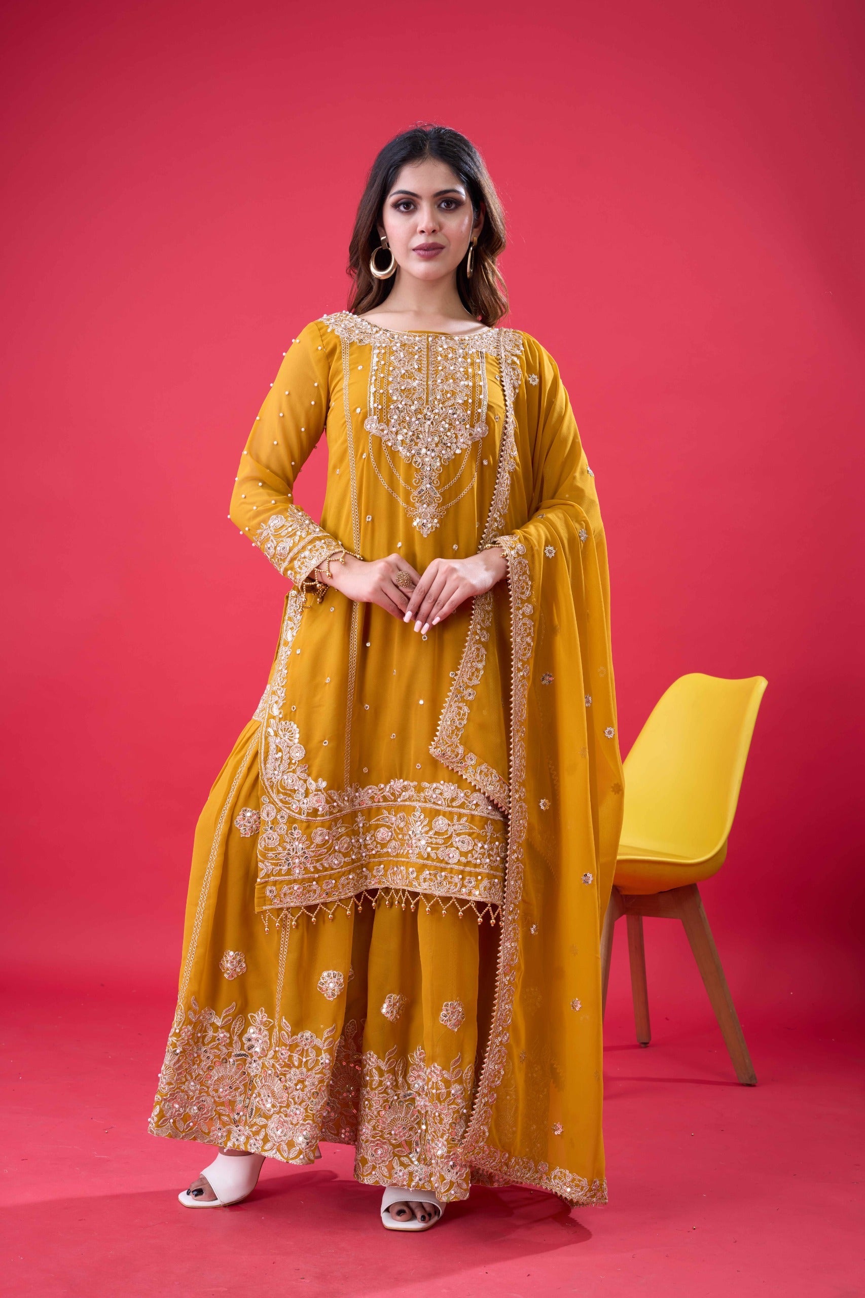 Yellow Faux Georgette palazzo suit with rivet moti and embroidery work