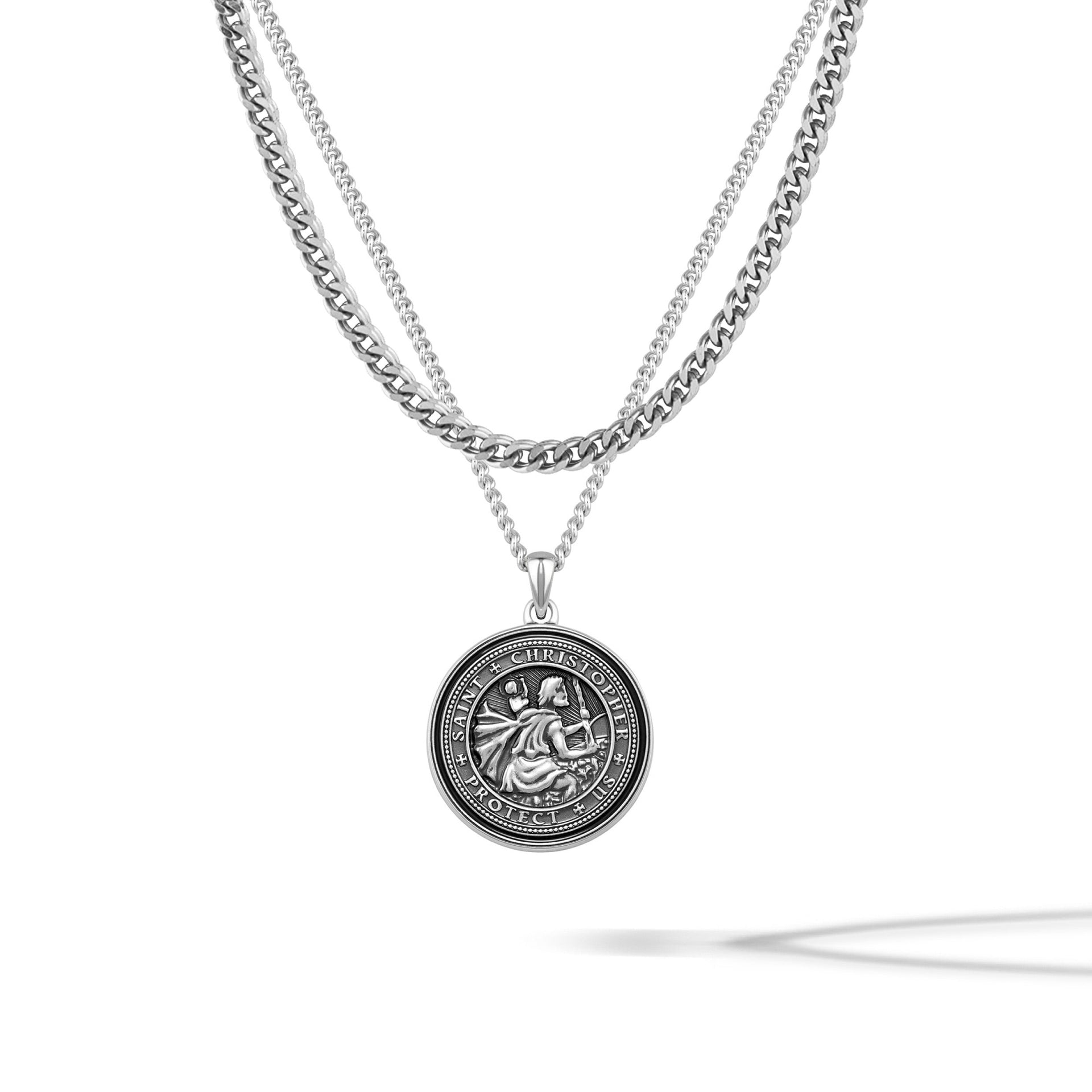 St. Christopher compass pendant featuring an onyx stone center paired with a sterling silver curb chain.