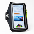Black EMF protection arm band phone pouch featuring reflective trim and a secure smartphone compartment.