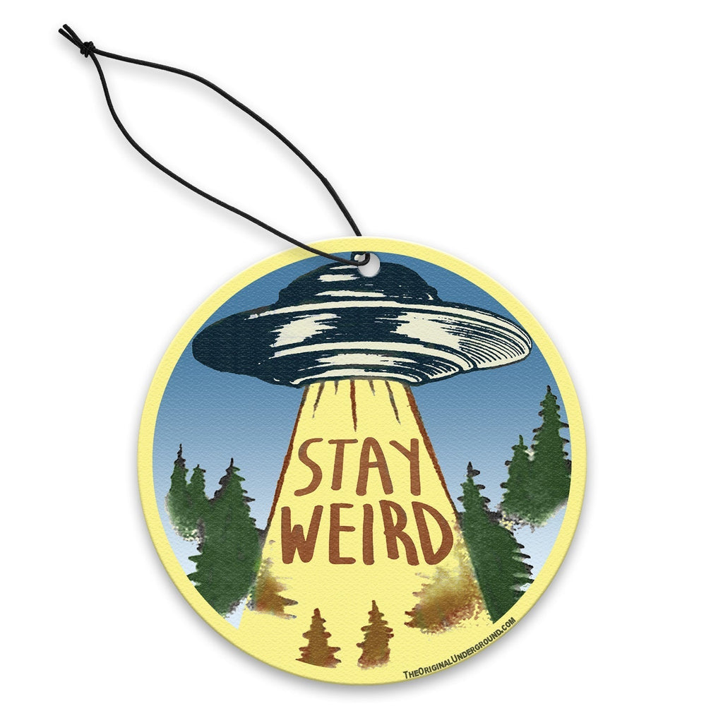 Retro-style Stay Weird air freshener in yellow and blue, perfect for car decor.