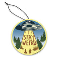 Retro-style Stay Weird air freshener in yellow and blue, perfect for car decor.
